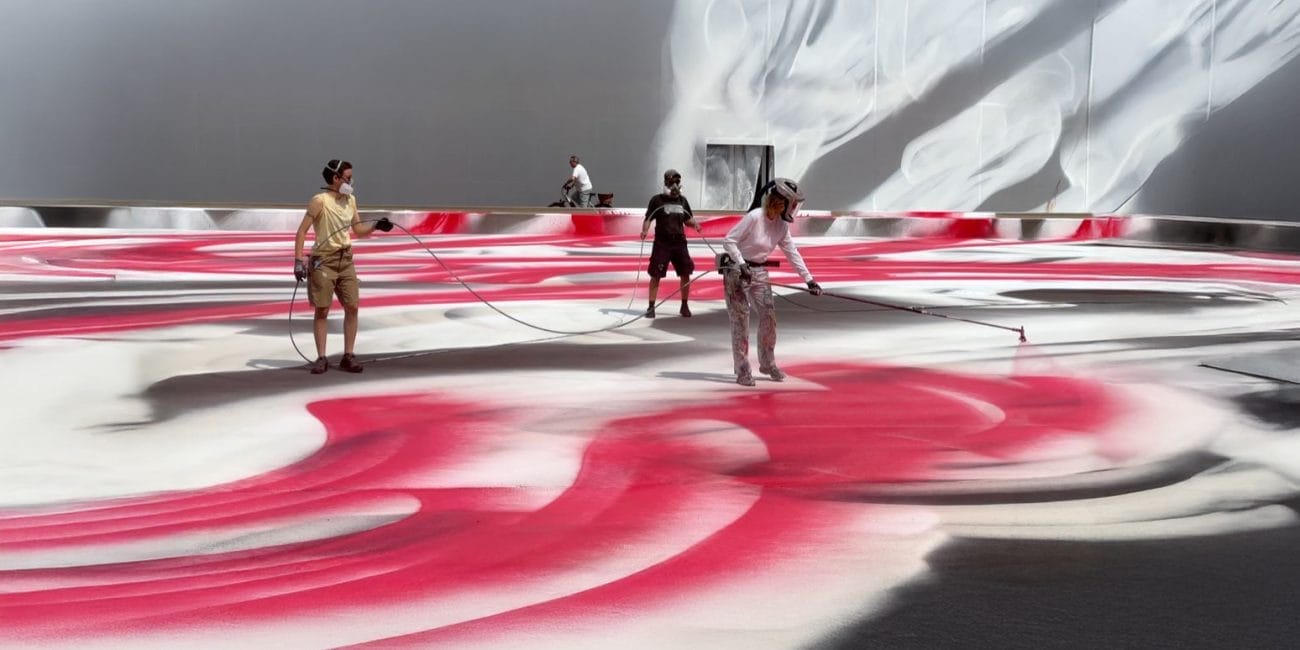 Katharina Grosse at work on her large-scale site-specific installation in Messeplatz, outside Art Basel 2025.