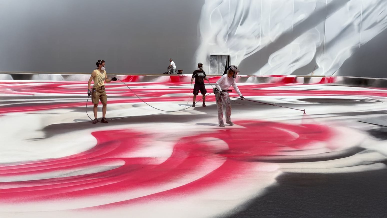 Katharina Grosse at work on her large-scale site-specific installation in Messeplatz, outside Art Basel 2025.